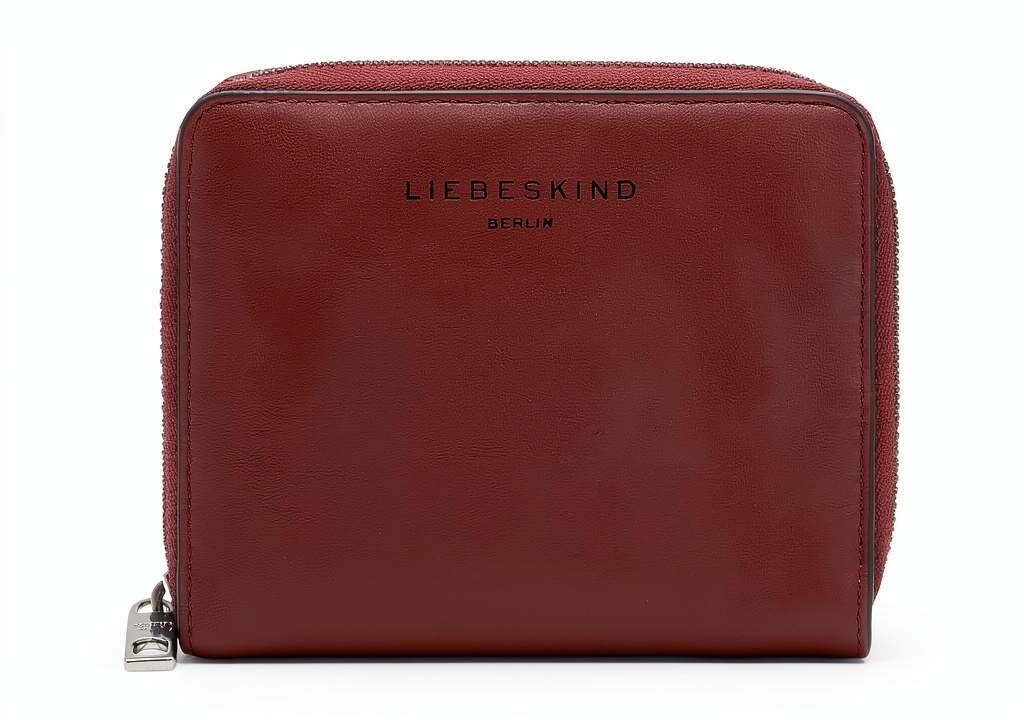 s.Oliver women's leather wallet in Pomegranate color on a table